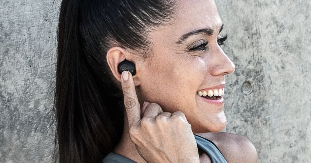 woman wearing jbuds earbud headphones