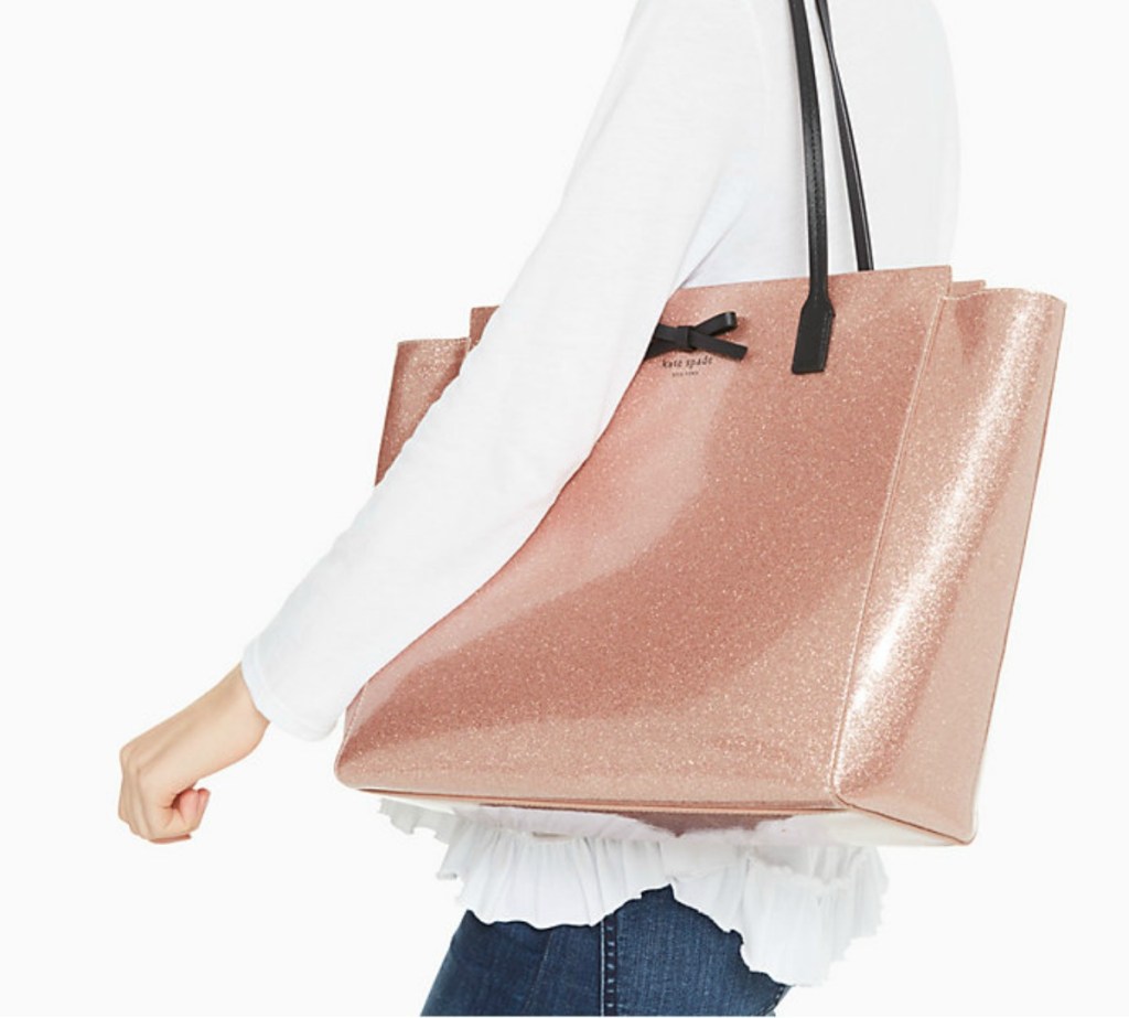 woman carrying Kate Spade Taden bag