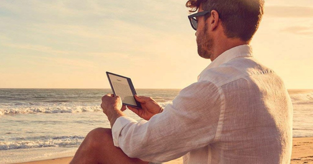 man reading a Kindle Oasis e-Reader