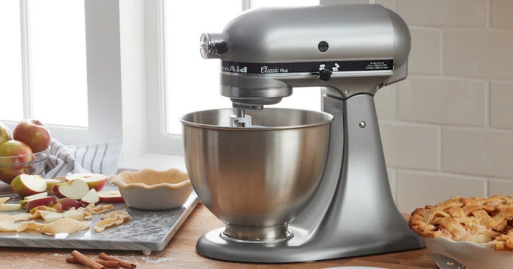 Stainless Steel KitchenAid Classic Plus Mixer on counter surrounded by baked goods
