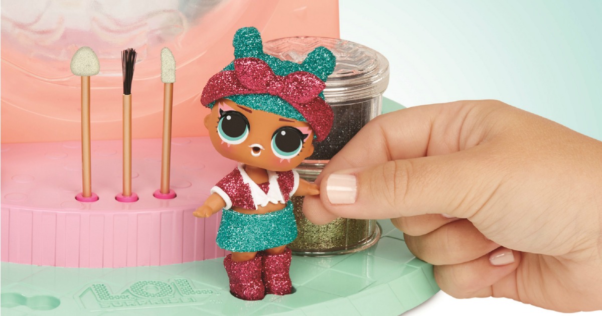 hand touching LOL Surprise doll with Glitter outfit