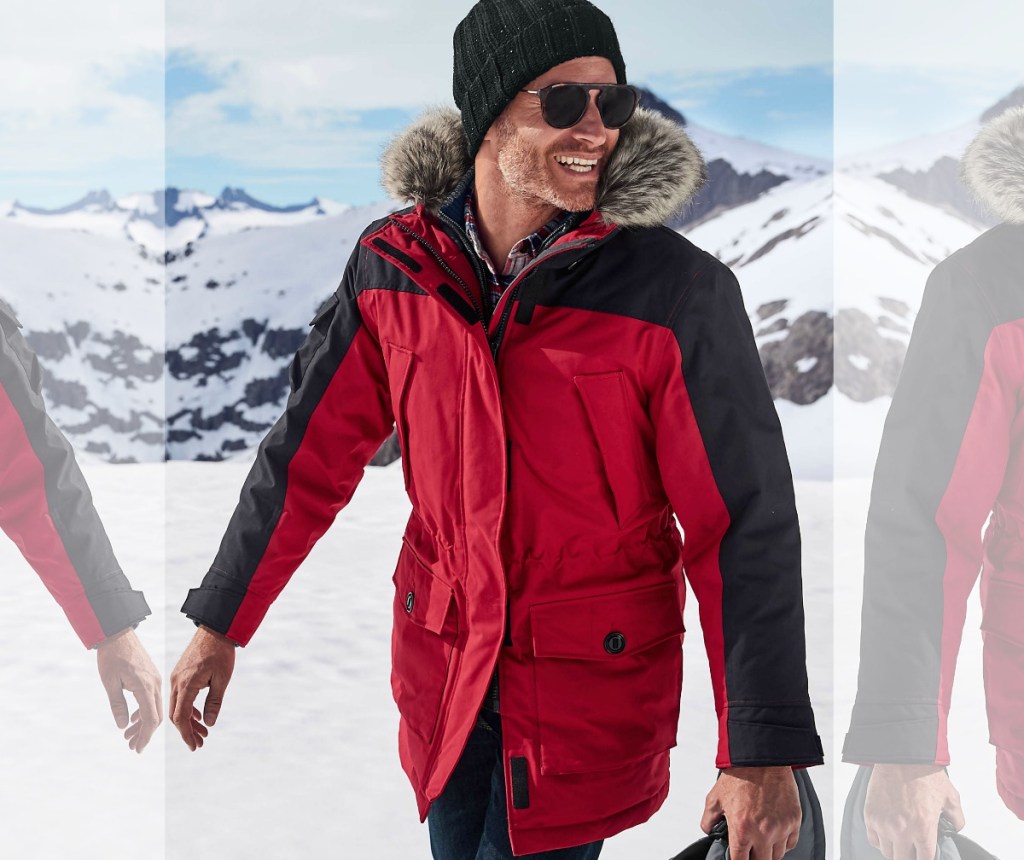 Man wearing a red Lands' End Winter Parka in the mountains