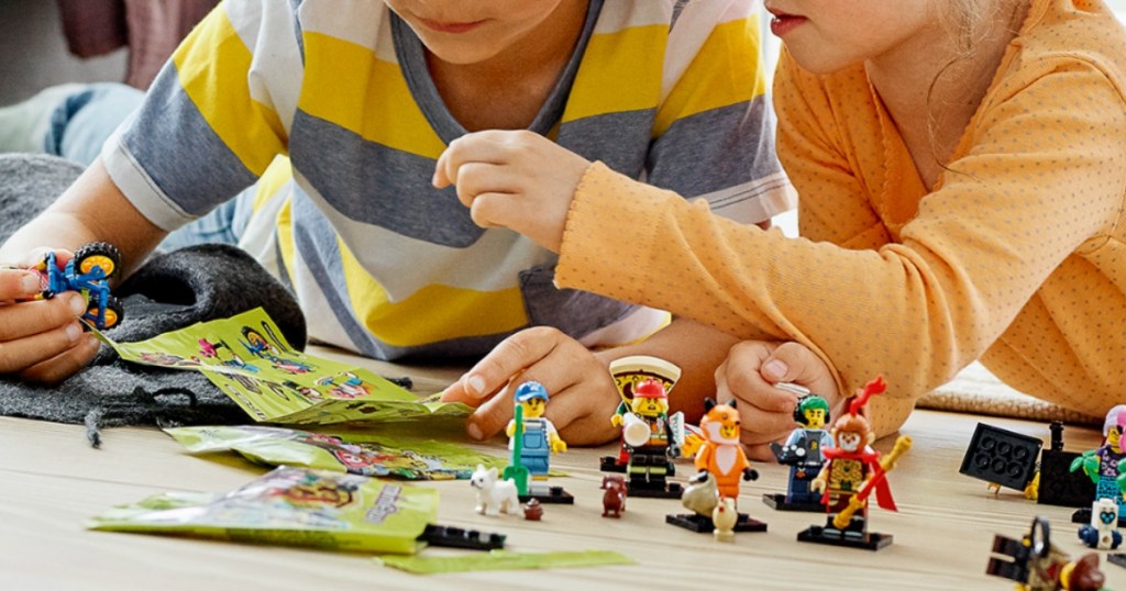 Kids playing on floor with LEGO Series 19 Minifigures Blind Bags