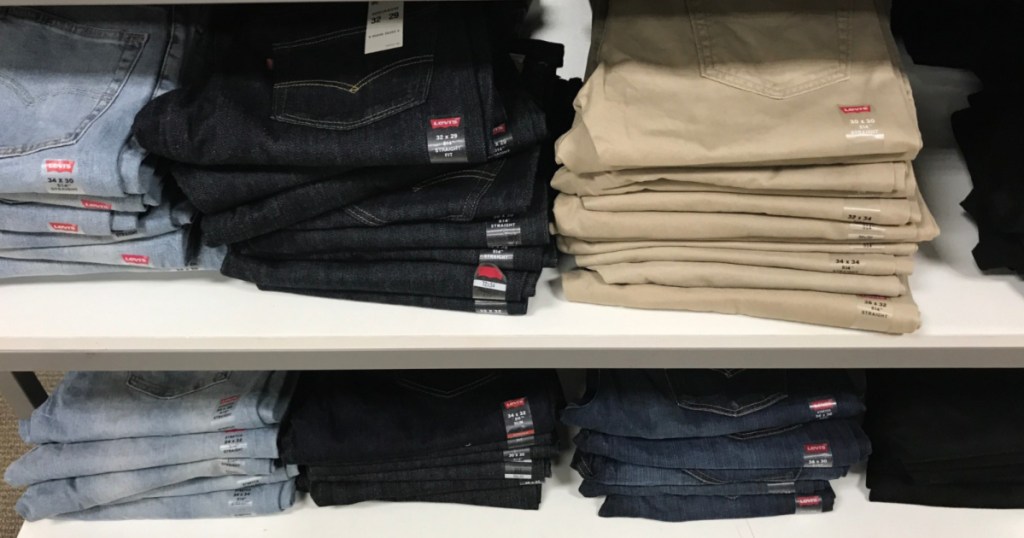 pairs of levi jeans on shelf at store