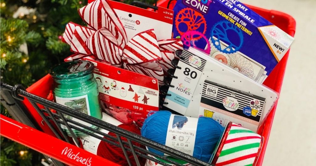Michaels cart filled with crafts, candles, yarn and holiday decorations