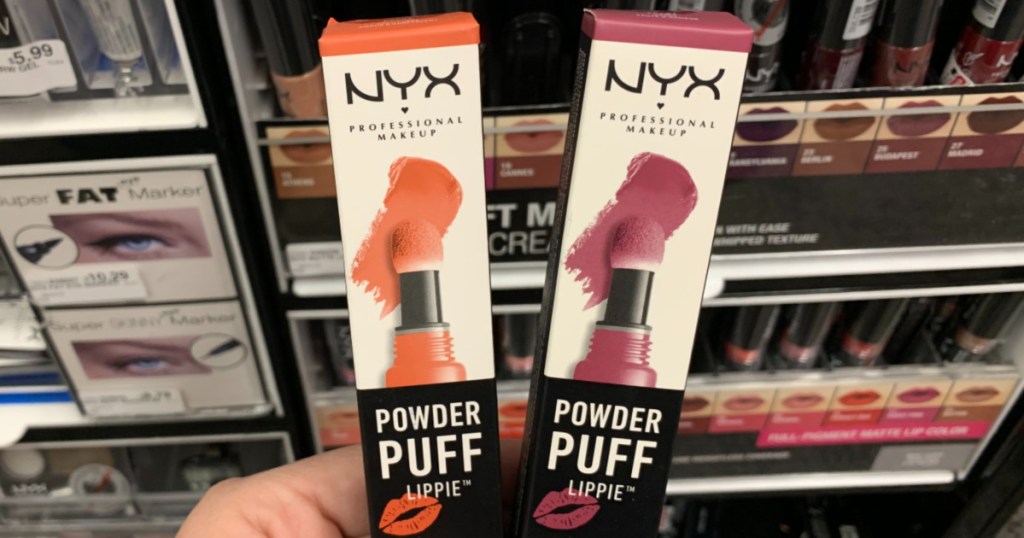 Hand holding NYX Lip products