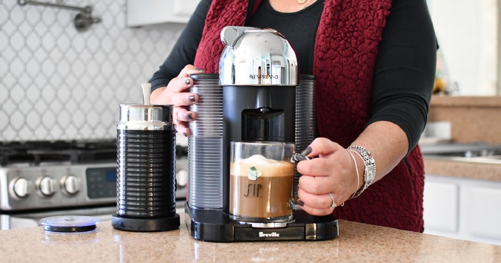 best nespresso machine - nespresso black friday deals - woman using coffee maker