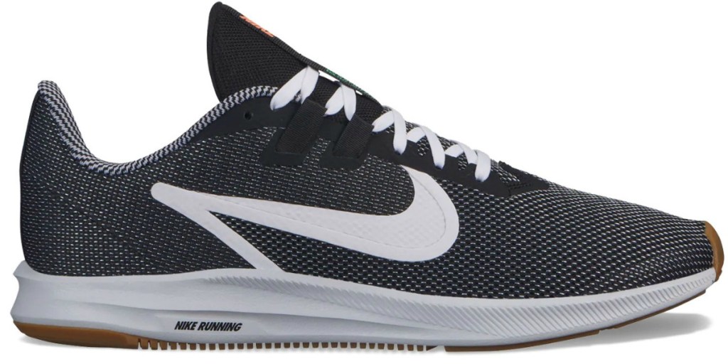 Nike brand men's running shoe in gray with white