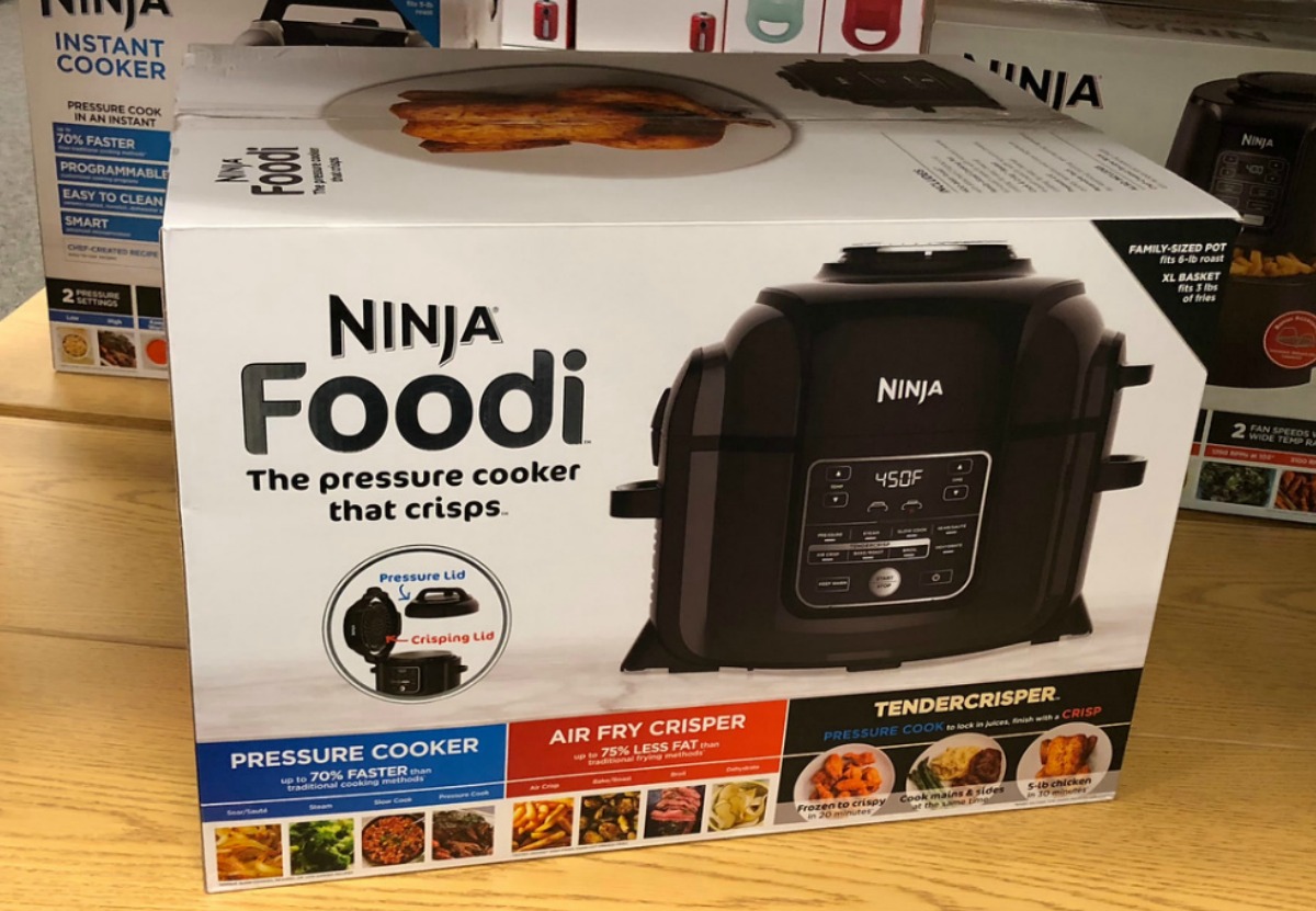 box with pressure cooker in it on store shelf