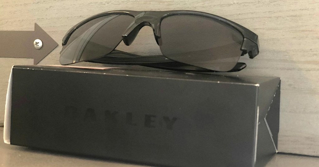 black Oakley sunglasses sitting on box 