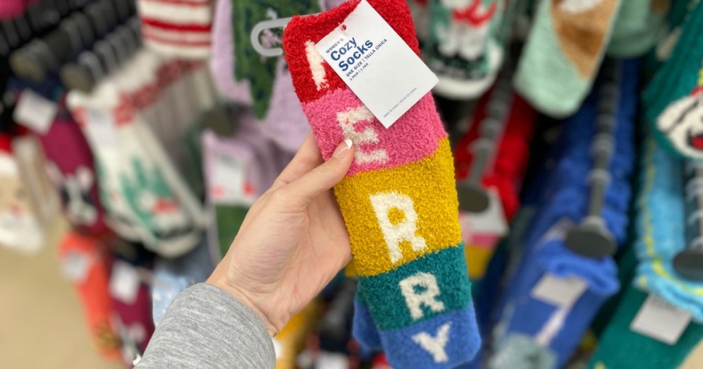 hand holding pair of Old Navy Cozy Socks