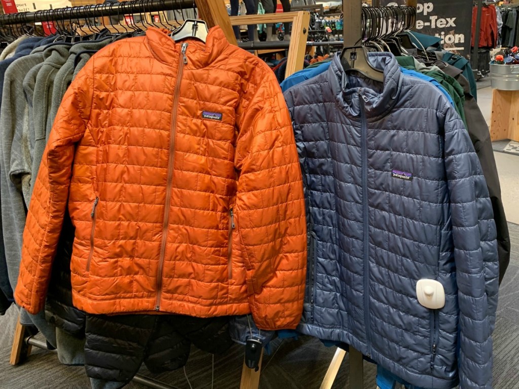 Patagonia Men's Puffer Jackets on display at REI