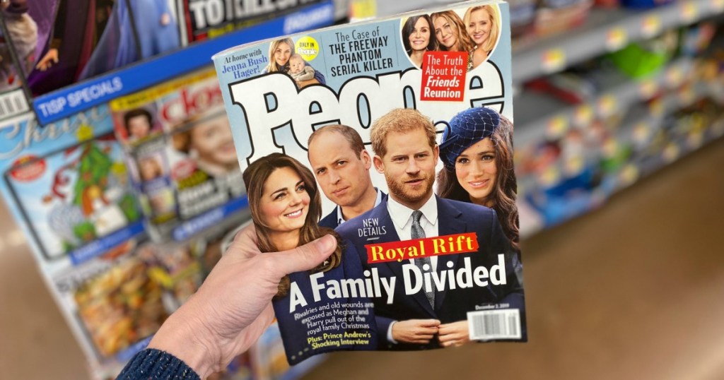 People magazine being held by a womans hand