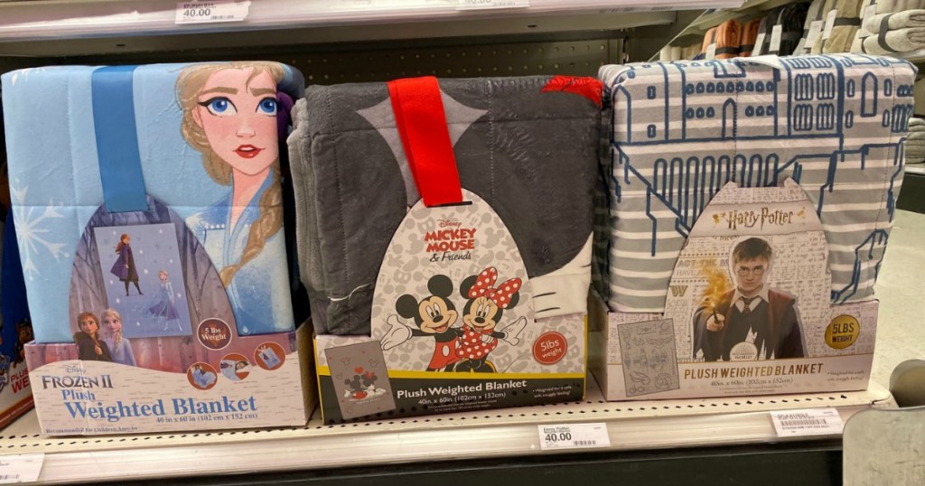 Character Plush Weighted Blanket on display on shelf in Target