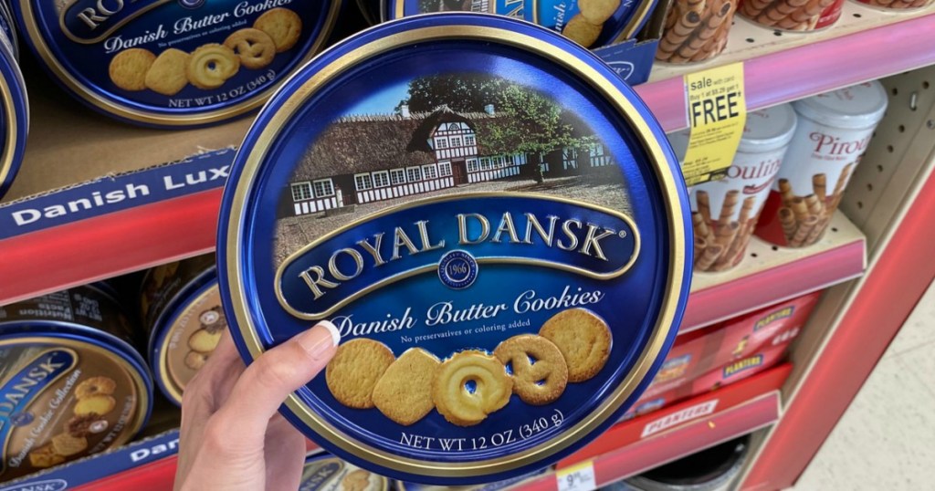 hand holding Royal Dansk Cookies in a store