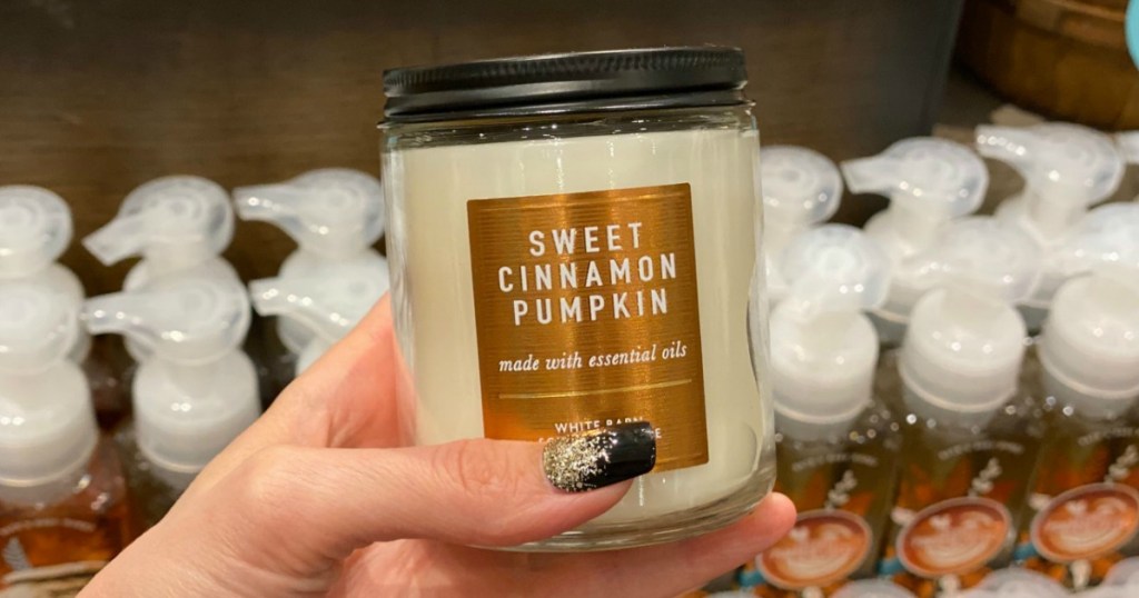 Single Wick Candle in hand in Bath & Body Works store