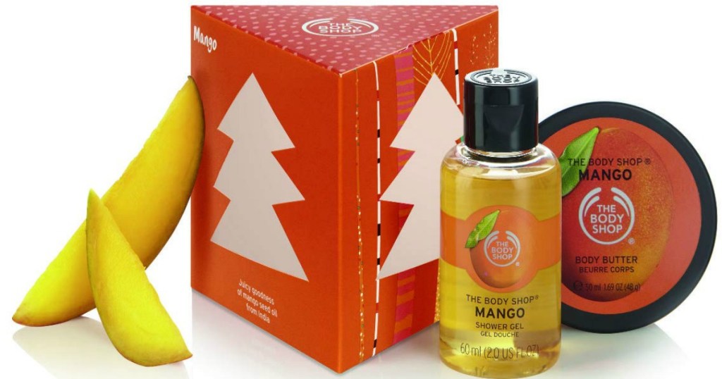 The Body Shop Mango Treats Cube Gift Set with mango slices leaning on the box
