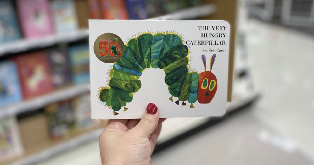The Very Hungry Caterpillar by Eric Carle being held by a woman