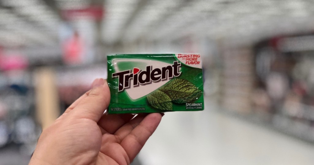 hand holding up pack of trident gum