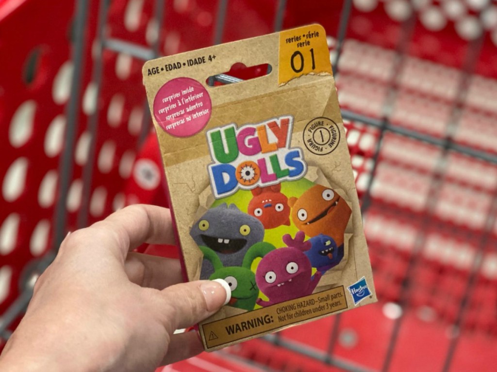 Ugly Dolls blind bag in hand near Target shopping cart