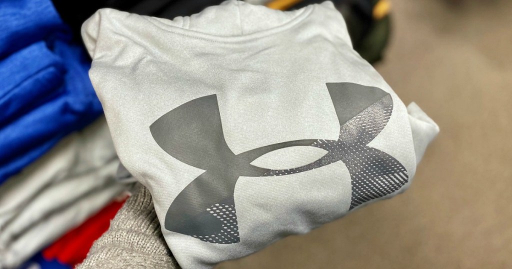 holding Under Armour Gray Boys hoodie