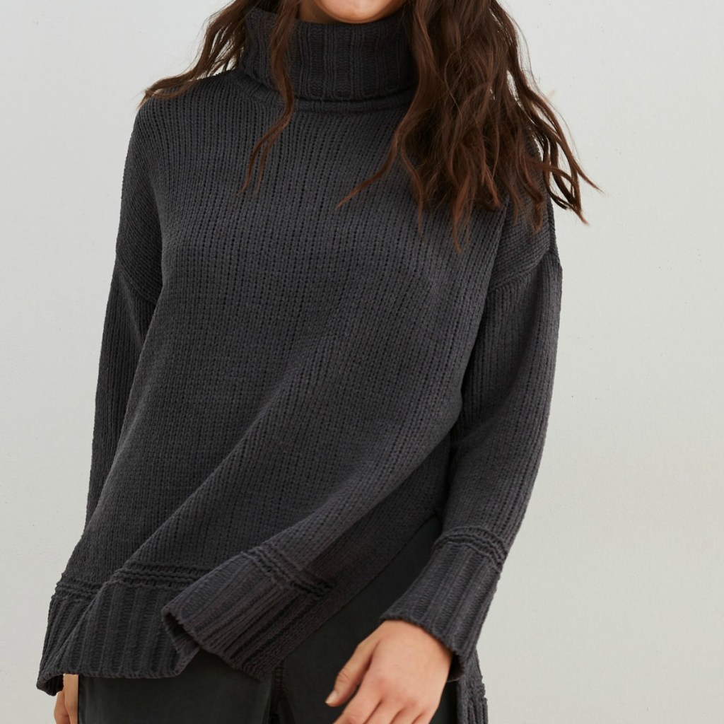 Woman wearing gray sweater