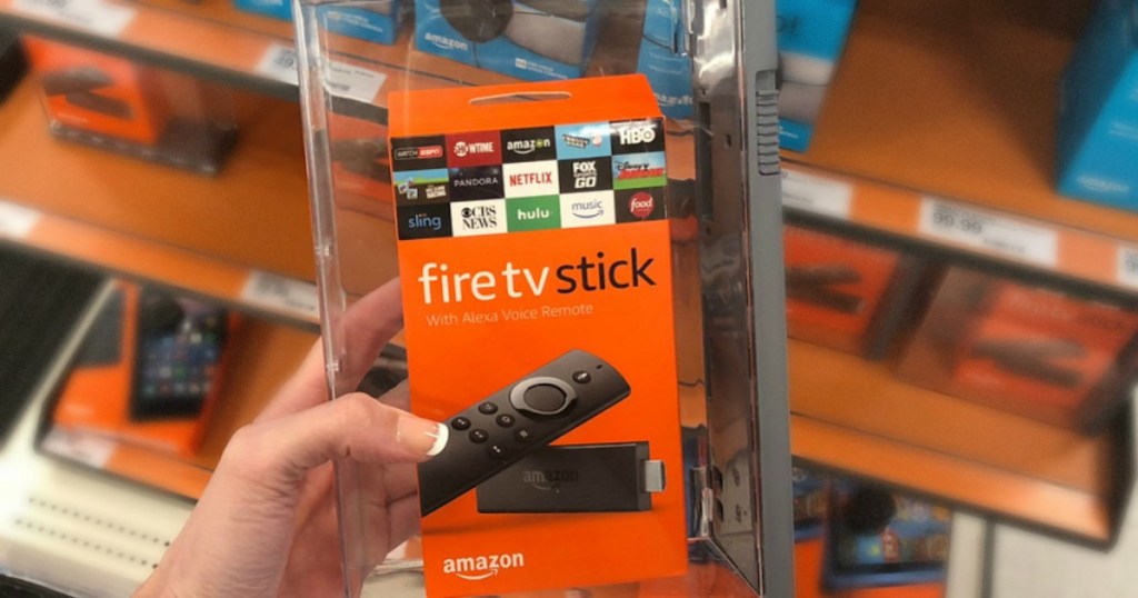 hand holding amazon fire tv stick box in store