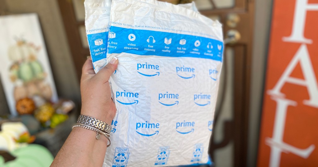 hand holding Amazon Prime packages