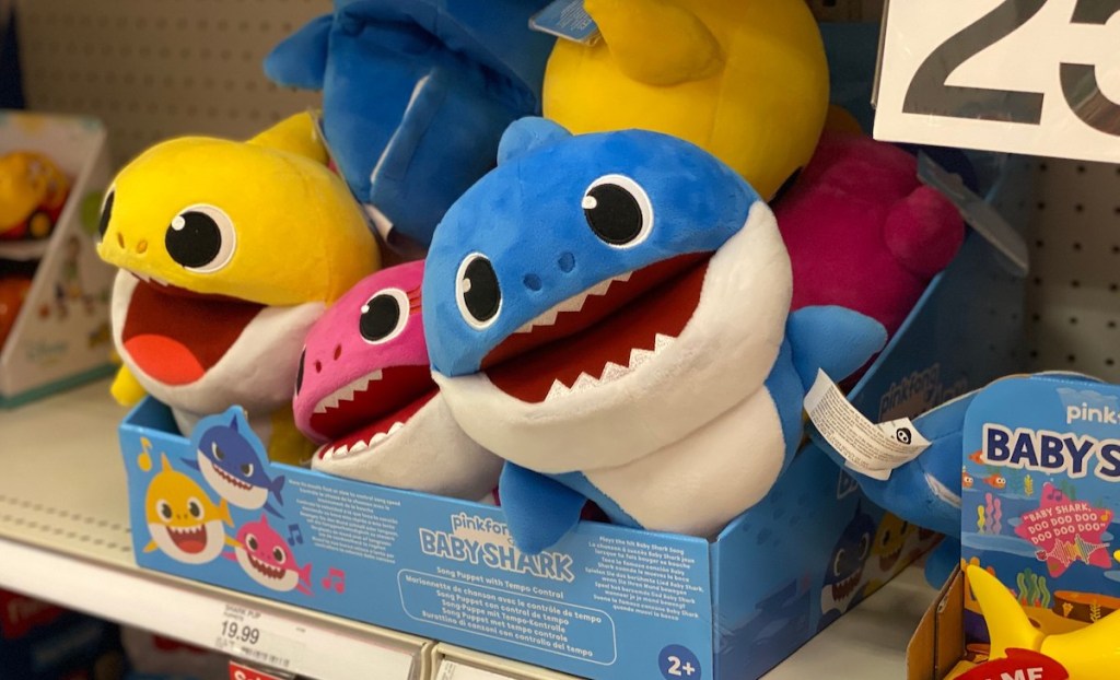 yellow pink and blue baby sharks on store shelf 
