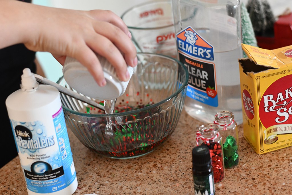 pouring contact solution into slime recipe