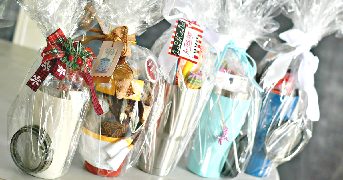 coffee mug tumblers decorated as gift baskets sitting in a row