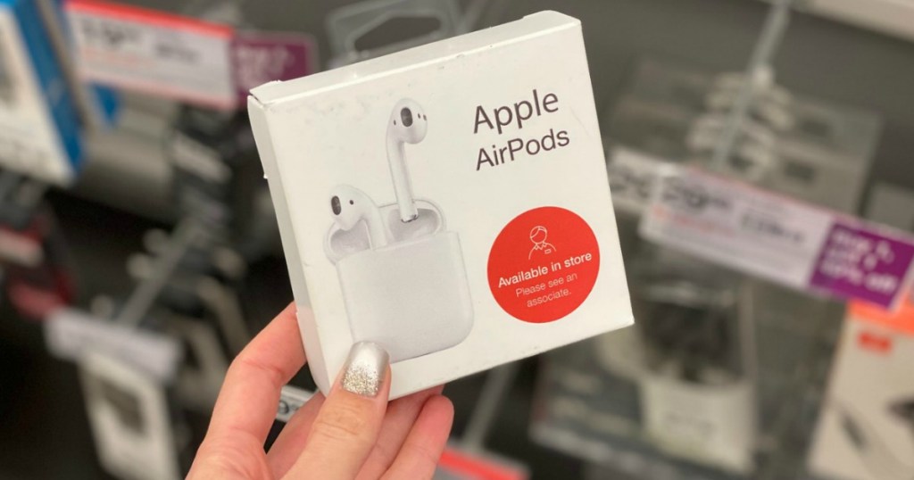 hand holding Apple AirPods