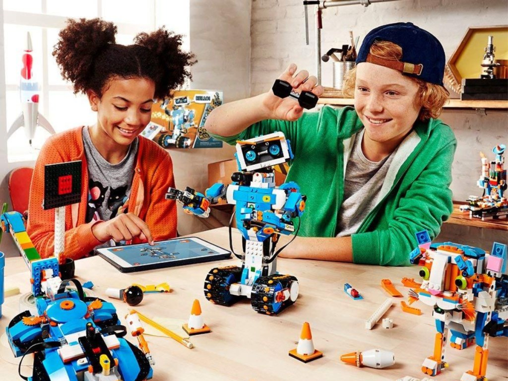boy and girl playing with robot and legos