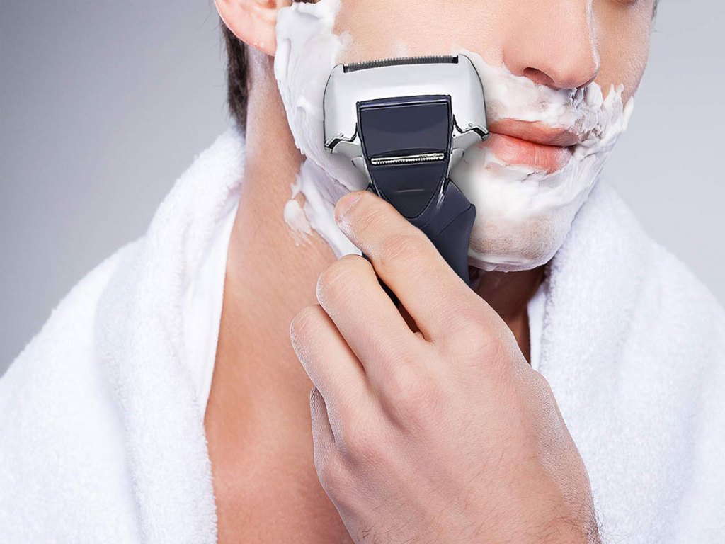 man shaving with gel on his face holding the Panasonic Arc4 Wet/Dry Electric Shaver w/ Pop-Up Beard Trimmer