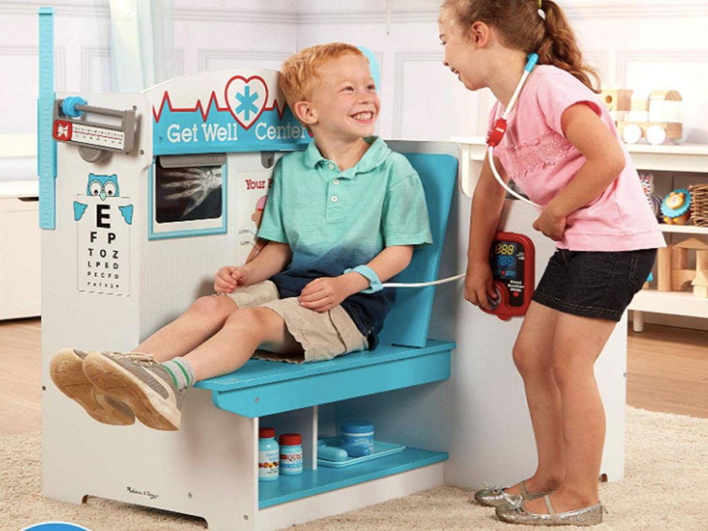 kids laughing and playing in the Melissa and Doug Get Well Doctor Activity Center