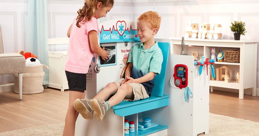 kids at play in the Melissa and Doug Get Well Doctor Activity Center