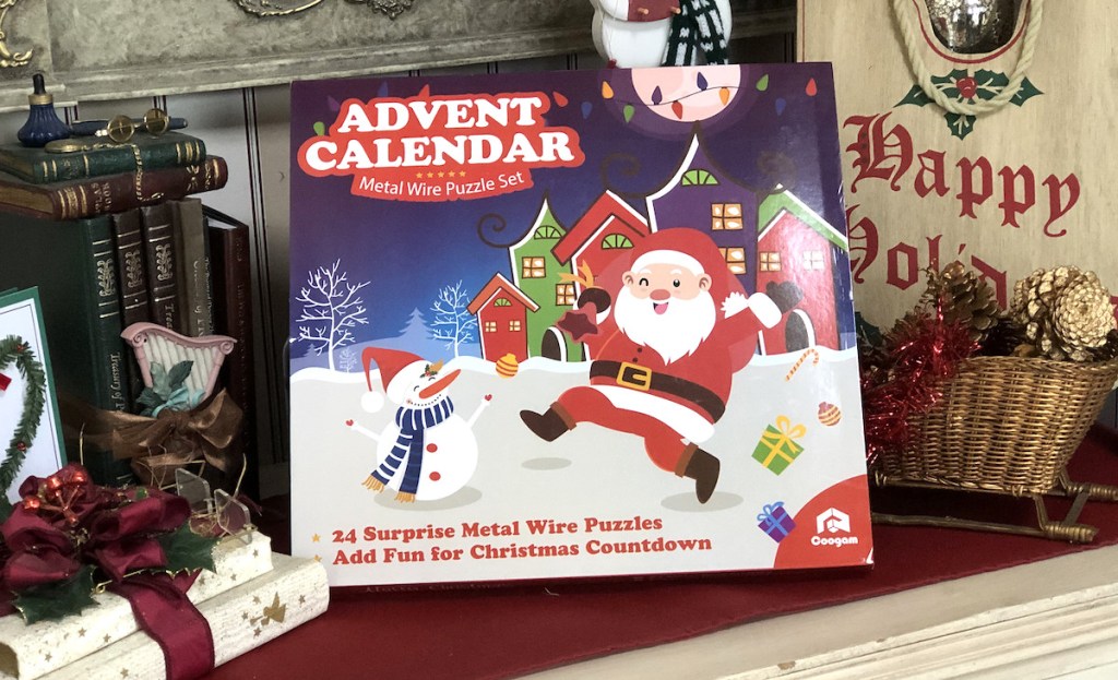 metal puzzle advent calendar sitting on table with christmas decor