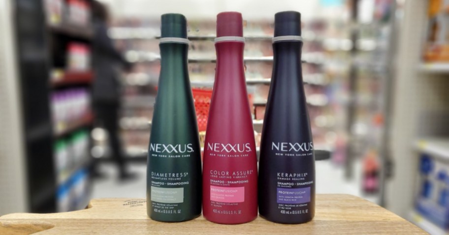 three bottles of nexxus shampoo at store