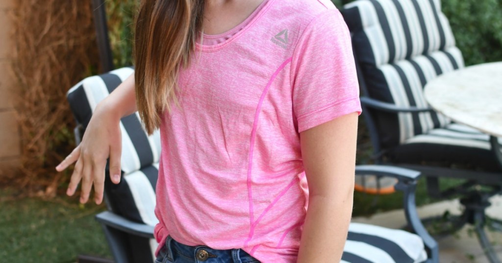 girl wearing pink reebok shirt