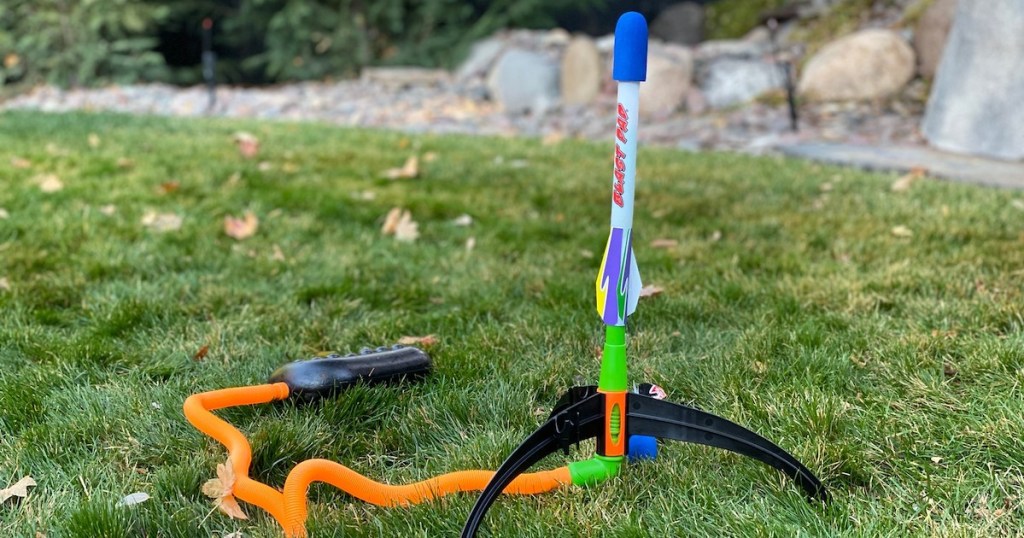 plastic rocket launcher outside in grass 