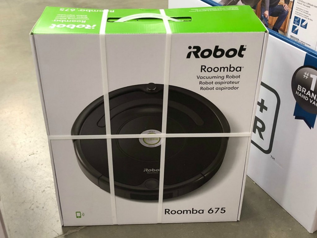 box with small floor vacuum in it