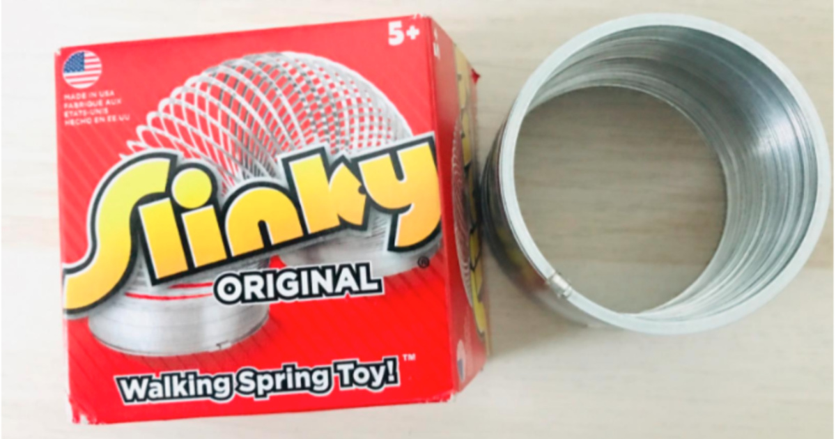 The Original Slinky laid on table