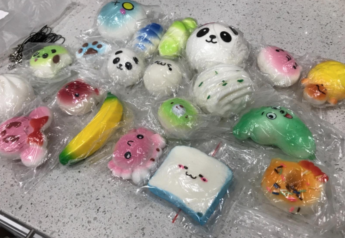 various types of small squishies in bags on counter