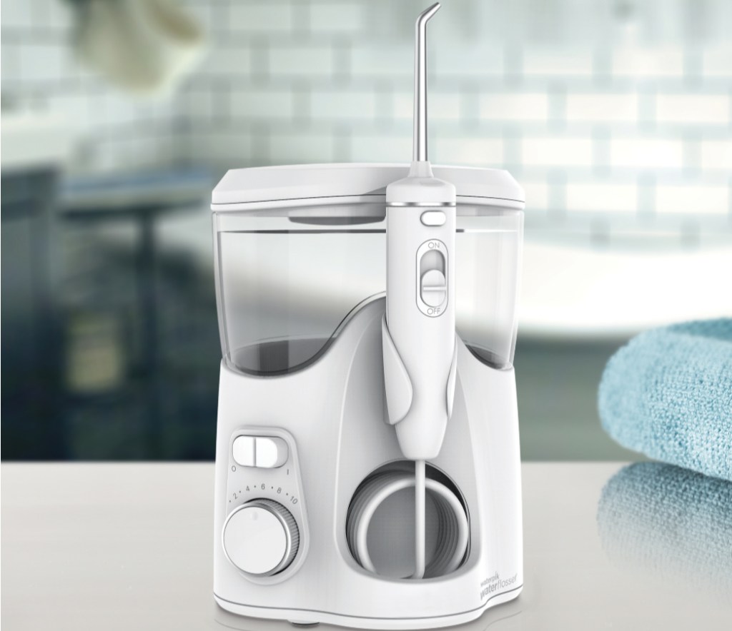 waterpik on counter with blurred background