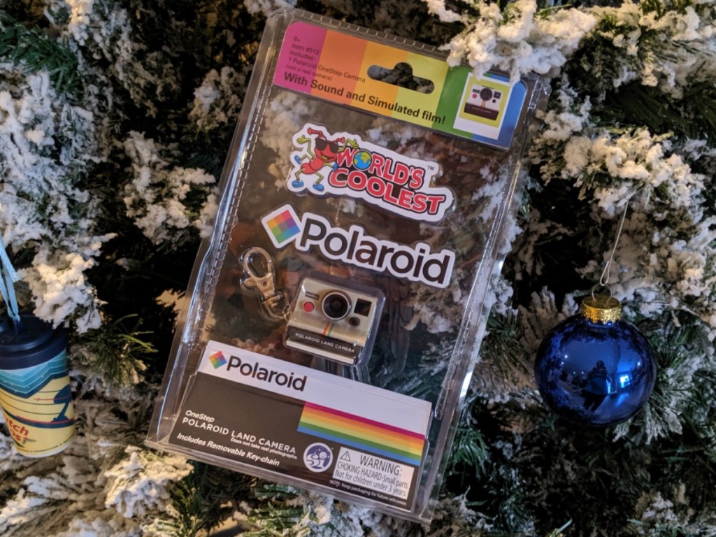 small camera toy in front of holiday decor