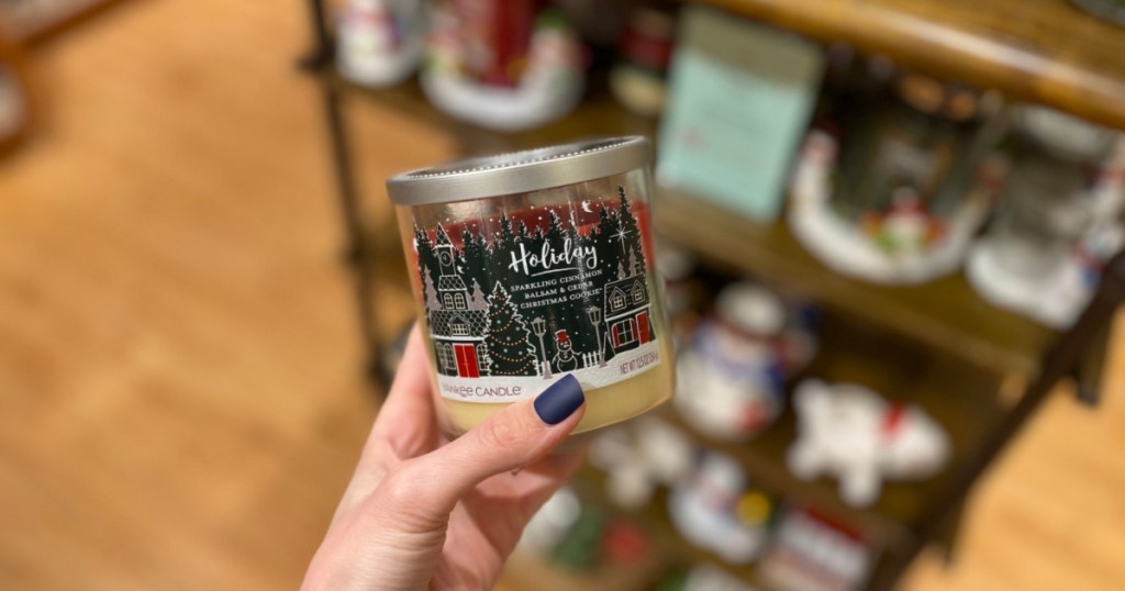hand holding holiday candle