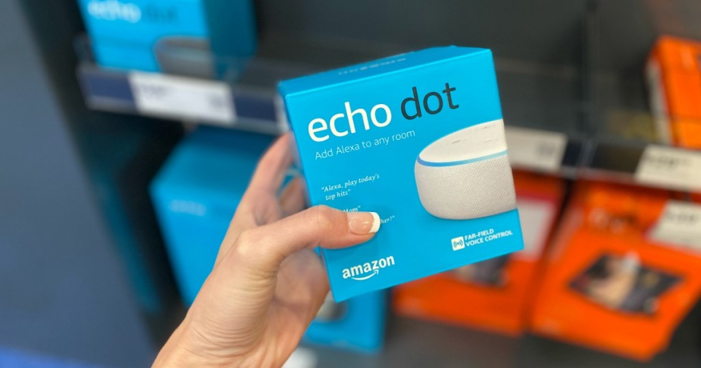 Woman holding Amazon Echo Dot