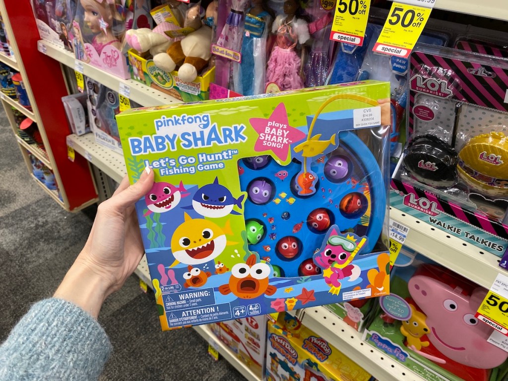 hand holding a Baby Shark Fishing Game