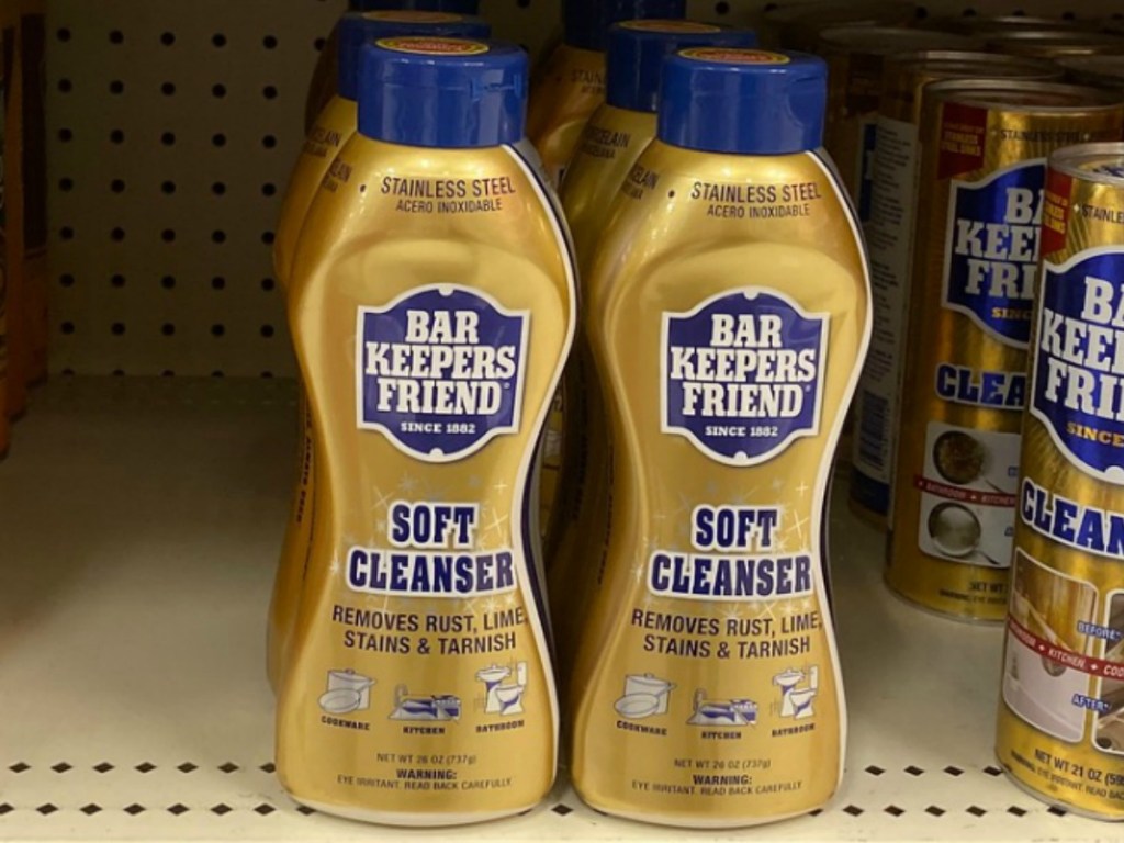 Bar Keepers Friend brand liquid cleanser in a gold bottle on a shelf in-store