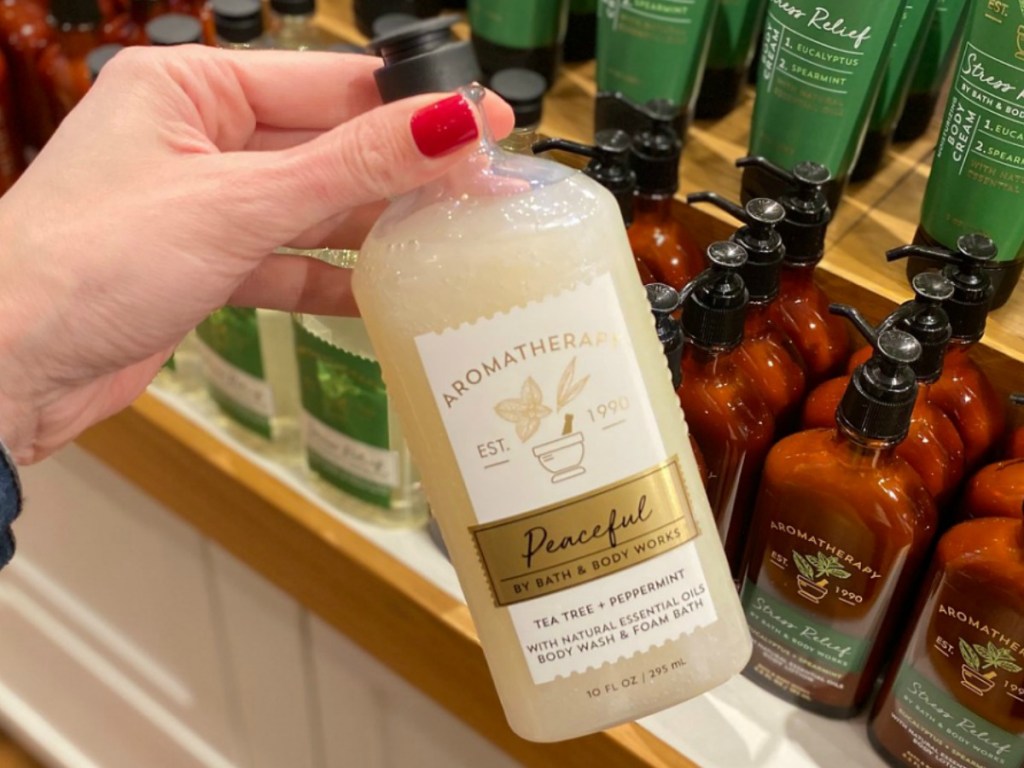 Bath & Body Works Aromatherapy product in hand in bottle in-store